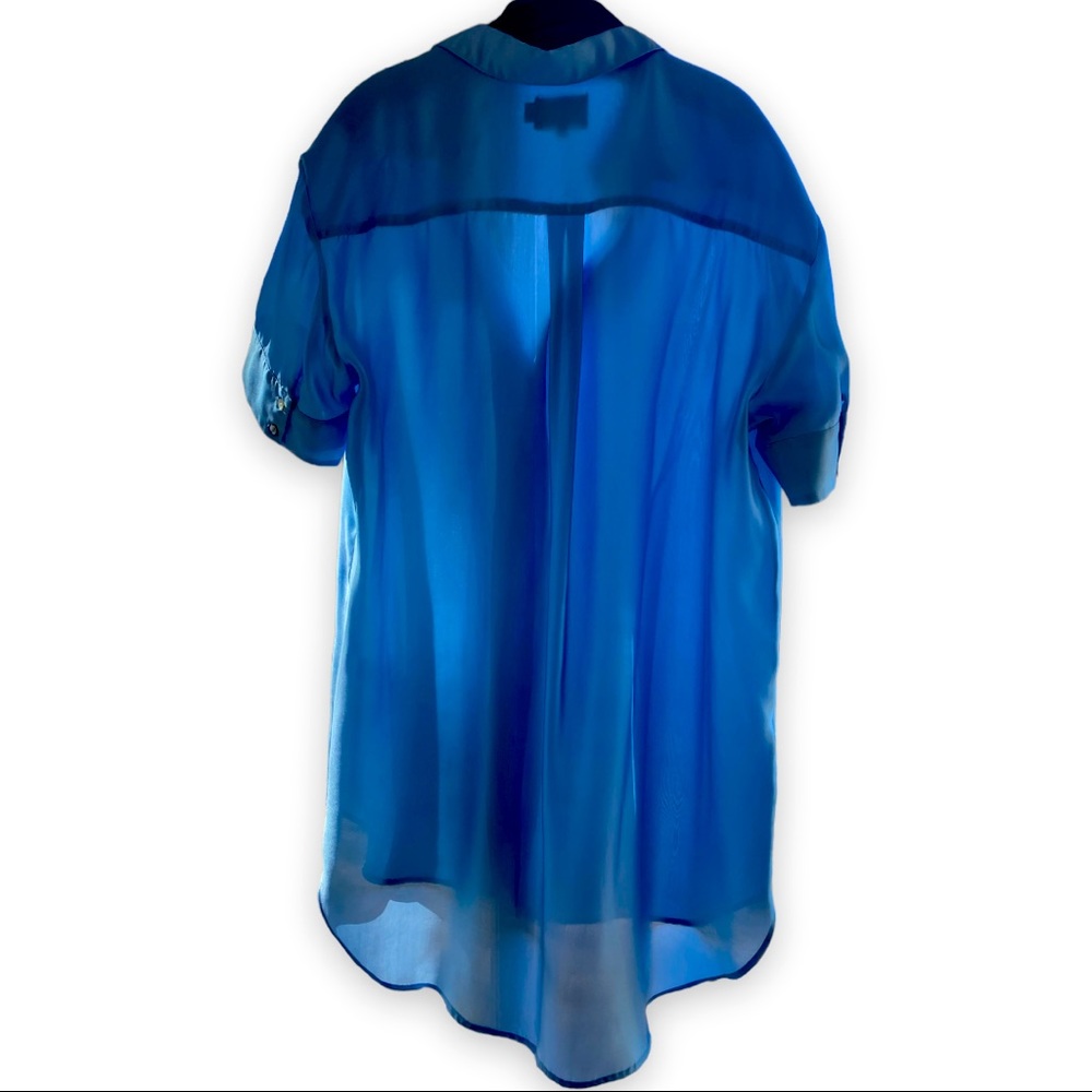 This blue tunic is perfect as a dress or top. Never worn.